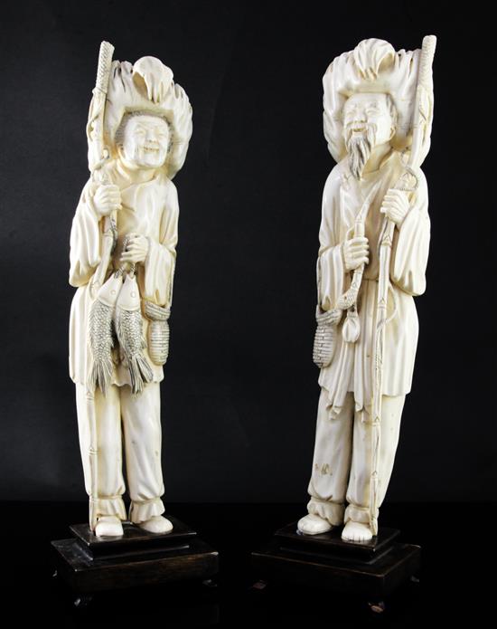 A pair of tall Chinese ivory figures of a fisherman and his wife, first half 20th century, 37cm excl. wood stands